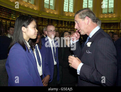 The Prince of Wales talks to Head Girl Chean San from Dunraven School in Streatham, London, at the Round Reading Room in the British Library, London. *...where the Prince attended a celebration to mark the end of The Everyman Millennium Library Project which provided free books to schools. The Project was funded by a 4 million grant from the Millennium Commission and an equal amount raised by other groups. Stock Photo