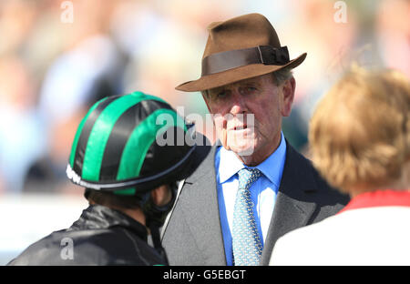 Jockey Eddie Ahern talks with trainer John Dunlop after winning The Stobart Doncaster Cup during the Ladbrokes St Leger Festival at Doncaster Racecourse. Stock Photo