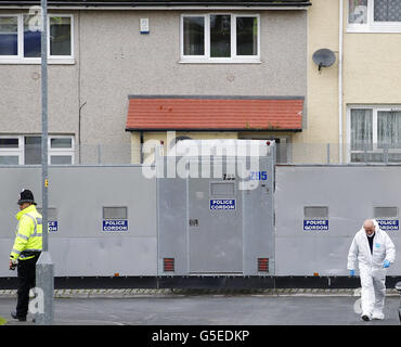 Police forensic officers continue to work at the scene of the shooting of Pcs Fiona Bone, 32, and Nicola Hughes, 23, in Hattersley, Greater Manchester. Stock Photo