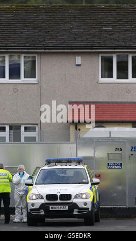 Police forensic officers continue to work at the scene of the shooting of Pcs Fiona Bone, 32, and Nicola Hughes, 23, in Hattersley, Greater Manchester. Stock Photo