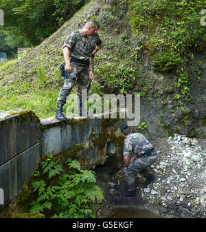Police inspect the scene of a shooting in downtown Ottawa on Wednesday ...