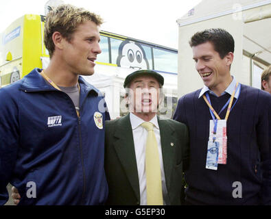 Olympic gold medalist rower James Cracknell (L), Former Formula One driver, Jackie Stewart, alongside British Tennis player Tim Henman before the Grand Prix at Silverstone. The Formula 1 race is expected to draw about 100,000 spectators. Stock Photo