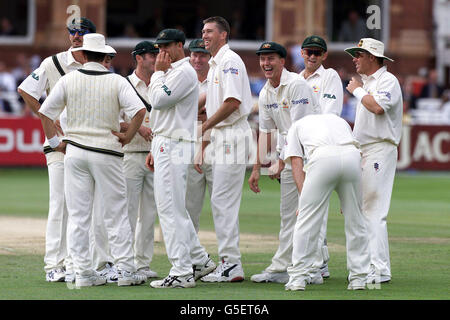 Australia's players (l to r) Jason Gillespie, Matthew Hayden, Steve Waugh, Glenn McGrath, Brett Lee, Adam Gilchrist, and Shane Warne laugh and smile as they watch the replay of Glenn McGrath taking wicket of England's Ian Ward first ball. * during the fourth day of the second nPower Test Match at Lords, London. Stock Photo