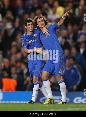 Chelsea's Emboaba Oscar (left) celebrates after scoring with team mate David Luiz (right) during the UEFA Champions League, Group E match at Stamford Bridge, London. Stock Photo
