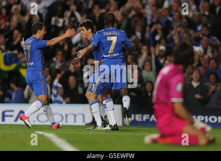 Chelsea's Emboaba Oscar (2nd left) celebrates after scoring as Juventus goalkeeper Gianluigi Buffon (right) looks on Stock Photo