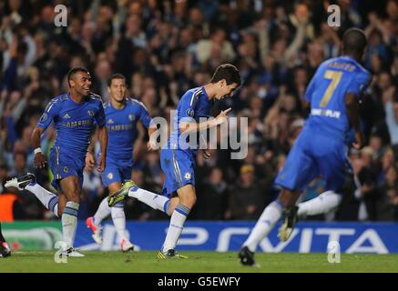 Chelsea's Emboaba Oscar (centre) celebrates after scoring their second goal during the UEFA Champions League, Group E match at Stamford Bridge, London. Stock Photo