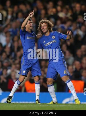 Chelsea's Emboaba Oscar (left) celebrates after scoring with team mate David Luiz (right) Stock Photo