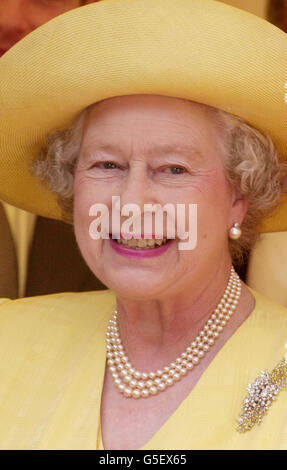 The Queen smiles after laying the foundation stone of the Memorial Gates, a monument to Indian, African and Caribbean World War volunteers, on Constitution Hill, central London. The Queen said her mother needed a good rest more than anything else. * She made the comment while attending the ceremony to lay the foundation stone of the first national memorial to recognise the contribution made in both world wars by volunteers from the Indian sub-continent, Africa and the Caribbean. The Queen had been asked by Major W P J Silva how her mother was getting along after she was admitted to hospital Stock Photo