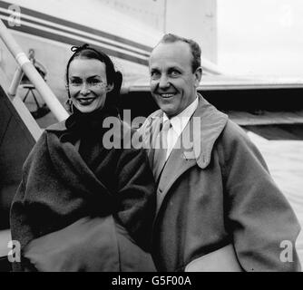 Mr William Randolph Hearst JR, American newspaper magnate and Mrs Hearst are seen as they board a BEA Viking plane at Northolt Airport for Paris on their way home to New York. They have been to England to see the Queen's coronation. Stock Photo