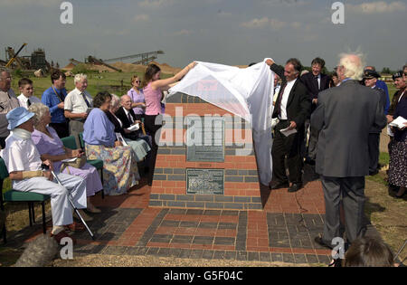 A memorial is unveiled by Nadir Imanoglu and Kirsty Donald, dedicated to the memory of Prisoners of War who died building the Sumatra Railway for their Japanese captors from 1944-5. *...The memorial, which takes the form of replica of a section of railway, was opened at the National Memorial Arboretum, at Alrewas near Lichfield. Stock Photo
