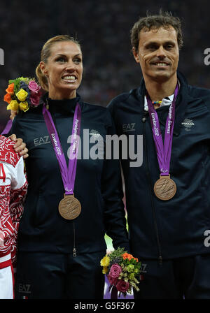 Italy's Annalisa Minetti with guide Andrea Giocondi celebrates winning Bronze in the Women's 1500m - T12 Final at the Olympic Stadium, London. Stock Photo