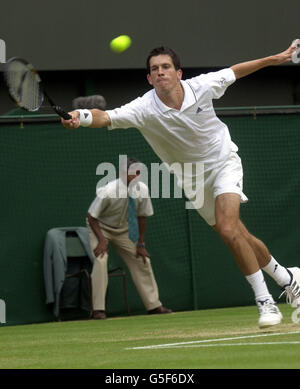 NO COMMERCIAL USE:Great Britain's Tim Henman in action against Goran Ivanisevic of Croatia during the second day of their Mens Semi Final match at the 2001 Lawn Tennis Championships at Wimbledon, London. Stock Photo