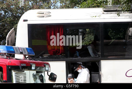 Emergency services at the scene of a coach crash on the A3 near Hindhead in Surrey, where three people died and others were left seriously injured when the coach overturned after colliding with a tree on an embankment. Stock Photo