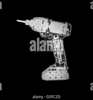 Cordless drill internal x-ray displaying its intricate components, power source, and mechanical structure, representing advanced engineering, repair, Stock Photo