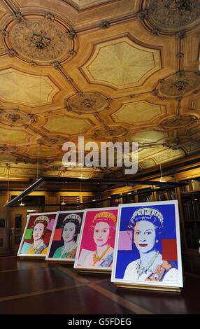 Andy Warhol's Reigning Queens: Queen Elizabeth II portraits on show in the Lower Library at Windsor Castle, after being acquired by the Royal Collection. Stock Photo
