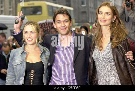 Actor Dougray Scott (centre) waves as he and co-stars Kate Winslet (left) and Saffron Burrows arrive for the premiere of the film 'Enigma' at the Odeon cinema in Edinburgh. Stock Photo