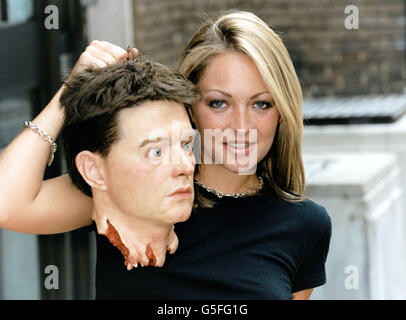 Model Jodie Shaw holds up a fake head during the launch of Fright Fest 2001, the UK's No. 1 horror, fantasy and science-fiction film festival. Page Three model Jodie appears in in 'Dust', which is shownig during the festival. Stock Photo