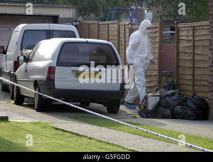 A forensic examiner enters the scene by the house belonging to policeman PC Karl Bluestone and his wife Jill who were found dead along with their young son Henry in an apparent 'murder-suicide'. * Officers found the bodies of the 31-year-old mother and her three-year-old son after they were called by neighbours to investigate a domestic dispute in Gravesend, Kent. The couple's three other children were rushed to the Darent Valley Hospital in Dartford, where their 18-month-old baby boy Chandler also died of his injuries. Officers then discovered the body of the 36-year-old Kent PC in a Stock Photo