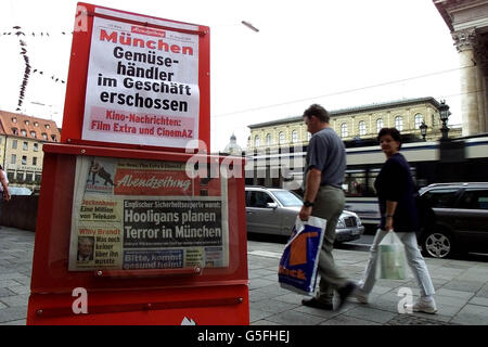 A German newspaper on the stands in Munich carries the headline that an English security expert warns that 'Hooligans plan terror in Munich'. English soccer fans were starting to arrive in the German city ahead of the World Cup Qualifying game. Stock Photo