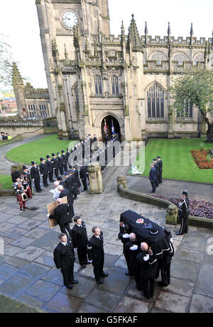 The coffin of Pc Fiona Bone, one of the two policewoman murdered in a gun and grenade attack, in Hattersley, Tameside, Manchester, on September 18, is carried into Manchester Cathedral, for her funeral service. Stock Photo