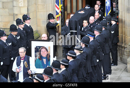 The coffin of Pc Fiona Bone, one of the two policewoman murdered in a gun and grenade attack, in Hattersley, Tameside, Manchester, on September 18, is carried from Manchester Cathedral, following her funeral service. Stock Photo