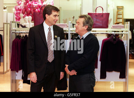 Marks & Spencer's Managing Director for UK Retail Roger Holmes (L) talks to per una designer George Davies, during a photocall at the Marks & Spencer's store in Marble Arch, London, where the exclusive per una womanswear range was launched. Stock Photo