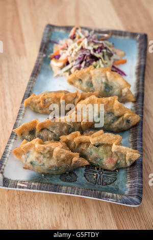 Korean Style Gyoza, Vegeterian Potstickers with soy sauce and pork Stock Photo