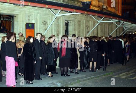 Guests in black-tie and evening wear queue for Robbie Williams in Concert at the Royal Albert Hall in London. Stock Photo