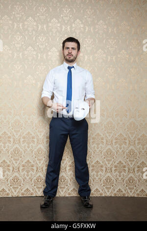 businessman shows the mask Stock Photo