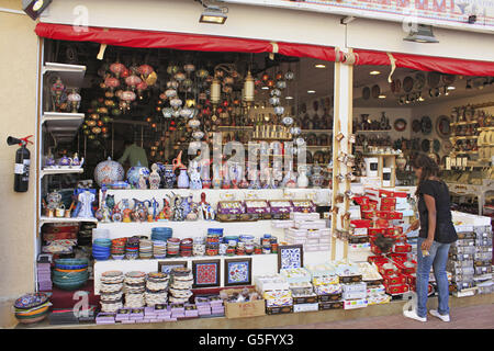Vibrant colorful ceramic artifacts, glass lamps for sale in a pavillion, Global village, Dubai, UAE Stock Photo