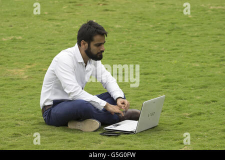 Corporate person working on a laptop, Magarpatta city, Pune, Maharashtra, India Stock Photo