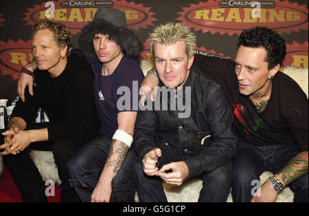 Lead singer Ian Astbury (2nd left), of rock group The Cult, with the rest of the band backstage at the 2001 Reading Music Festival. Stock Photo