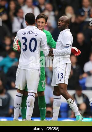 Tottenham Hotspur's William Gallas (right), goalkeeper Hugo Lloris (centre) and Raniere Sandro (left) after the final whistle. Stock Photo