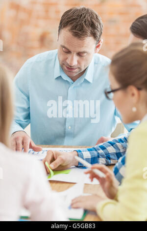 Diverse people working with financial reports Stock Photo