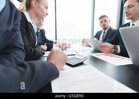 Business people analyzing financial figures of reports Stock Photo