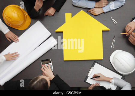 Top view of people around table in construction business meeting Stock Photo