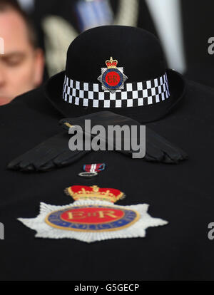 The hat, gloves and Queen's Jubilee medal, lay on top of the coffin of Pc Fiona Bone, one of the two policewoman murdered in a gun and grenade attack, in Hattersley, Tameside, Manchester, on September 18, as it is carried from Manchester Cathedral, following her funeral service. Stock Photo