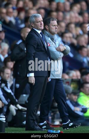 Soccer - Barclays Premier League - West Bromwich Albion v Queens Park Rangers - The Hawthorns. Queens Park Rangers manager Mark Hughes (left) with assistant manager Mark Bowen (right) on the touchline. Stock Photo