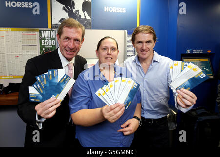 Horse Racing pundit Derek Thompson (left) with William Hill shop manager Debbie Brookes (centre) and jockey A.P.McCoy during the photocall at William Hill Bookmakers, Worcester. Stock Photo