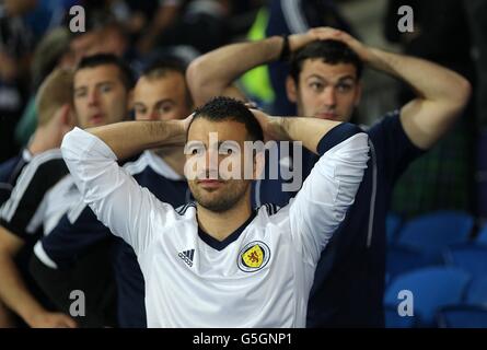 Soccer - World Cup 2014 Qualifying - Group A - Wales v Scotland - Cardiff City Stadium. Scotland fans dejected in the stands after the final whistle Stock Photo
