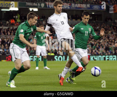 Republic of Ireland's Keith Fahey (right) and Germanys Miroslav Klose in action during the 2014 FIFA World Cup Qualifying match at the Aviva Stadium, Dublin, Ireland. Stock Photo