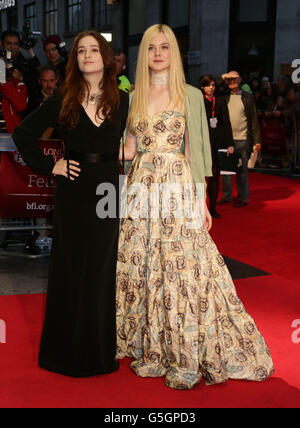 Elle Fanning (right) and Alice Englert arriving for the BFI London Film Festival premiere of Ginger And Rosa at the Odeon West End, in Leicester Square, London. Stock Photo