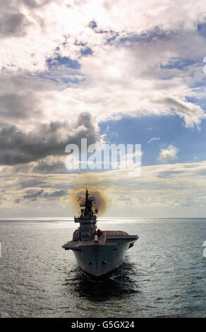 The Royal Navy aircraft carrier HMS Ark Royal sails into Portsmouth harbour after a two year major refit in Rosyth, Scotland. The Ark Royal which will become fully operational next year, has spent the past two and a half years being modernised. *to take on board the navy's new anti-submarine Merlin helicopters, as well as be able to operate Seakings, Sea Harriers and RAF harriers. Stock Photo