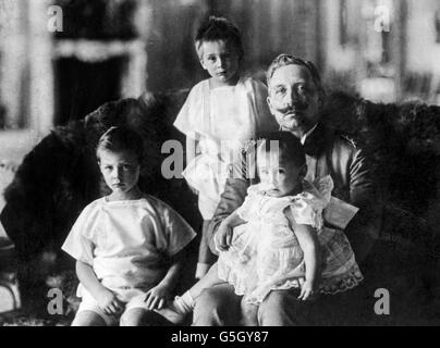 Kaiser Wilhelm II with his grandchildren. From left to right: Prince Wilhelm, Prince Louis Ferdinand and Prince Hubertus. Stock Photo