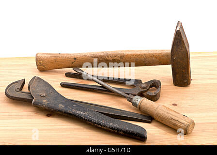 old used tools on the wooden desk Stock Photo