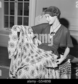 1,000 wool wardrobe, chooses a dress from Jean Muir's Spring collection in the West End. Stock Photo