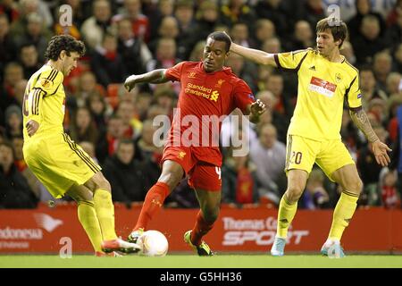 Soccer - UEFA Europa League - Group A - Liverpool v Anzhi Makhachkala - Anfield. Liverpool's Andre Wisdom battles for the ball with Anzhi Makhachkala's Fedor Smolov (right) and Yury Zhirkov (left) Stock Photo