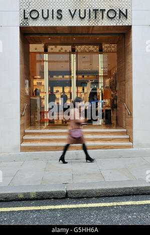 Customers leave a newly-opened Louis Vuitton (LV) flagship store in  Shanghai, China, May 5, 2010. Manufacturers of luxury fashion and accessory  bran Stock Photo - Alamy