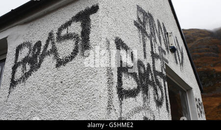 Slogans painted on the cottage owned by Jimmy Savile in Glencoe, Scotland. Stock Photo