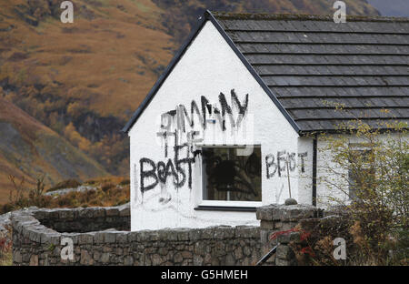 Slogans painted on the cottage owned by Jimmy Savile in Glencoe, Scotland. Stock Photo